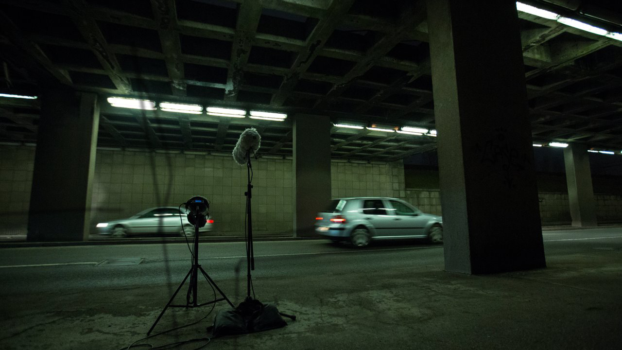 Branko is operating a powertool while Matko is pointing the shotgun microphone at it.