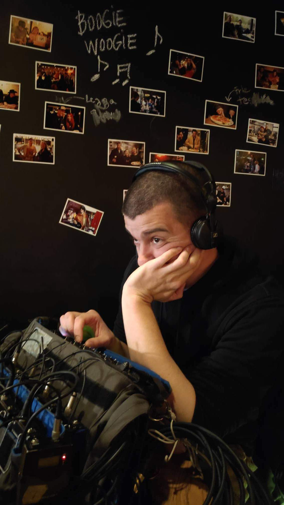 A rock shaped like a face betwee the trees.